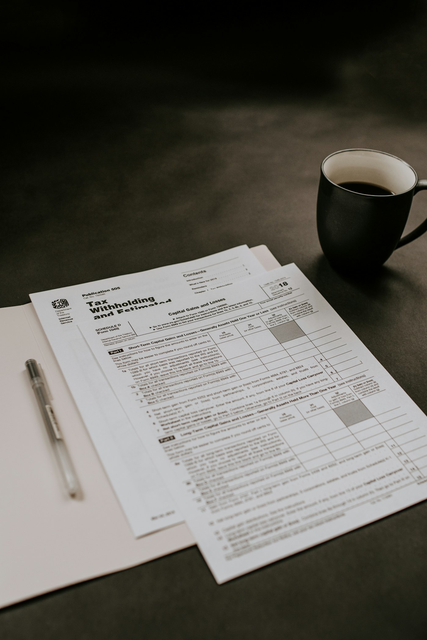Invoice paperwork and calculator on a desk